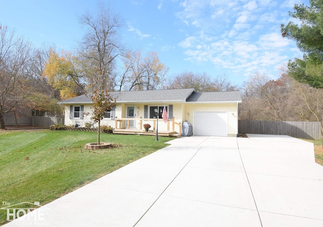 ranch-style home featuring a front yard, a porch, and a garage