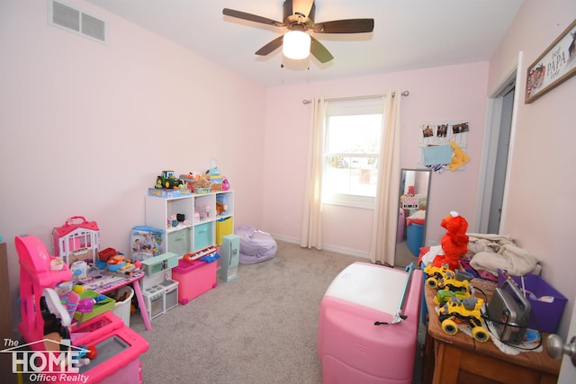 recreation room with carpet flooring and ceiling fan