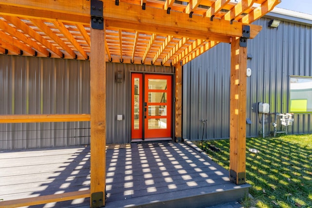 entrance to property with a pergola