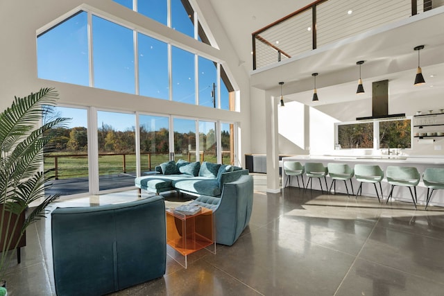 living room with a wealth of natural light and high vaulted ceiling