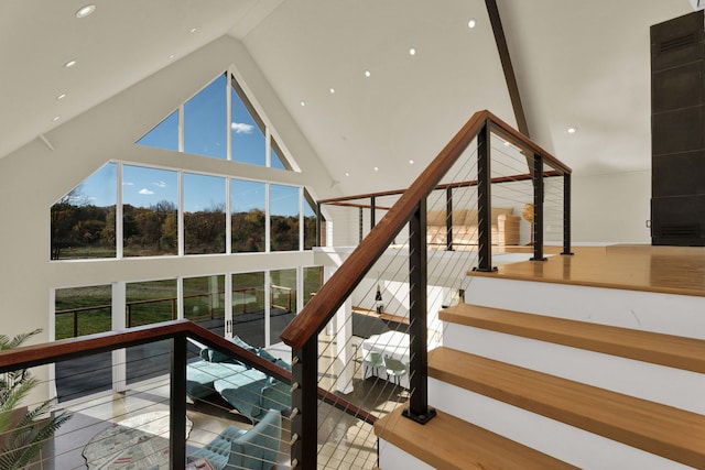 stairway with high vaulted ceiling