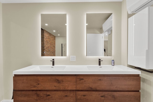 bathroom with a wall mounted air conditioner and vanity