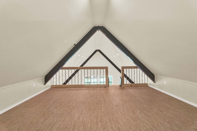 bonus room featuring lofted ceiling and carpet floors