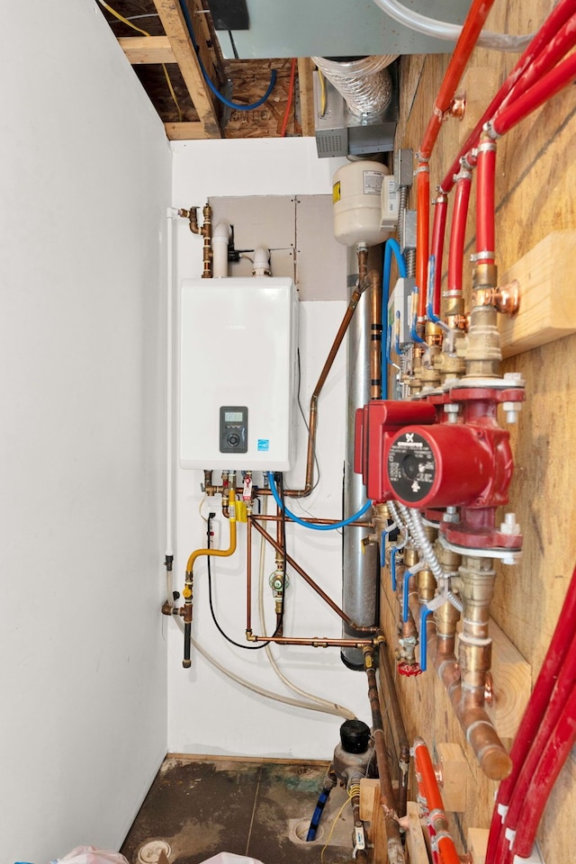 utility room featuring tankless water heater