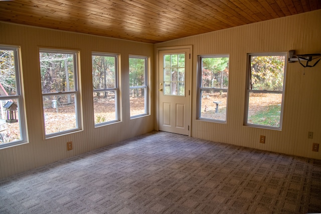 unfurnished sunroom with wooden ceiling