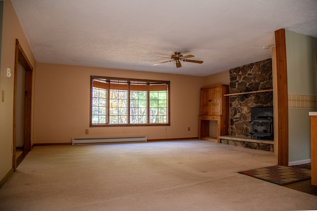 unfurnished living room featuring ceiling fan, carpet floors, a baseboard radiator, and a textured ceiling