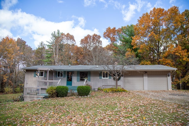 ranch-style house with covered porch and a garage