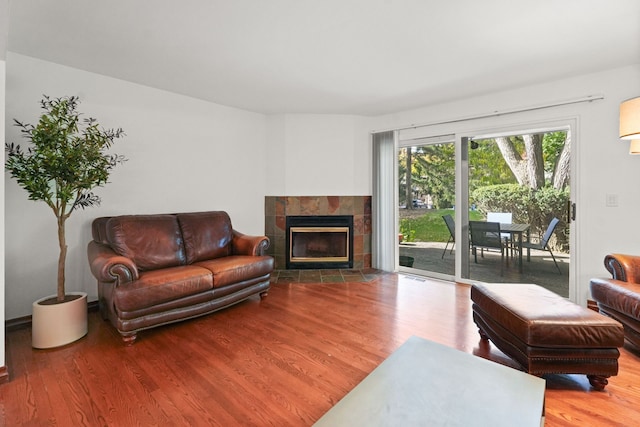 living room featuring hardwood / wood-style floors and a fireplace