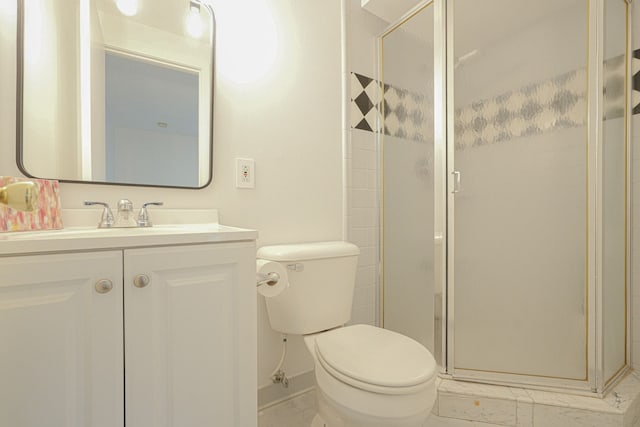 bathroom featuring vanity, toilet, and walk in shower