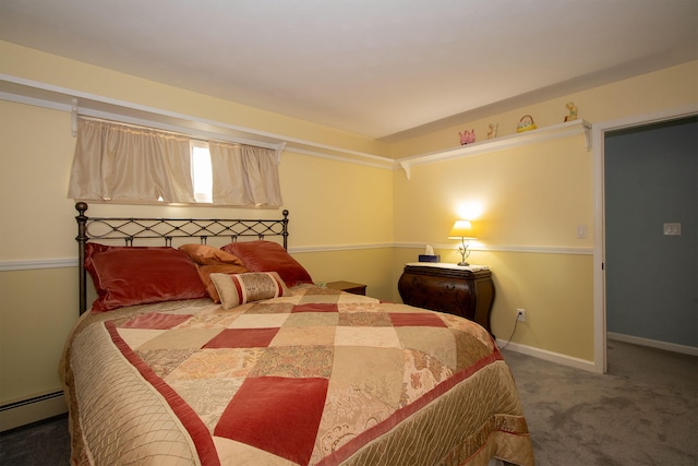 bedroom with carpet and a baseboard radiator