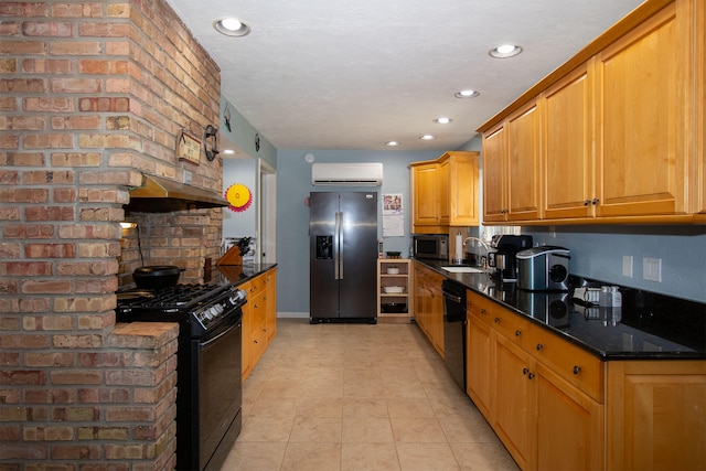 kitchen featuring a wall mounted air conditioner, black appliances, sink, dark stone countertops, and light tile patterned floors