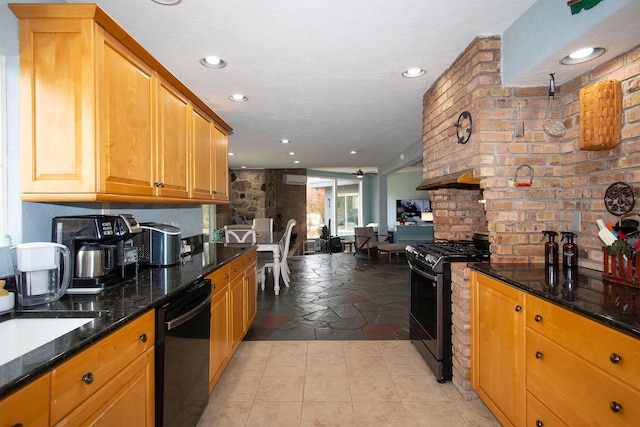 kitchen with gas stove, a large fireplace, sink, black dishwasher, and dark stone countertops