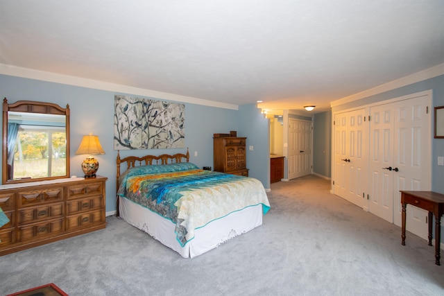 carpeted bedroom featuring crown molding