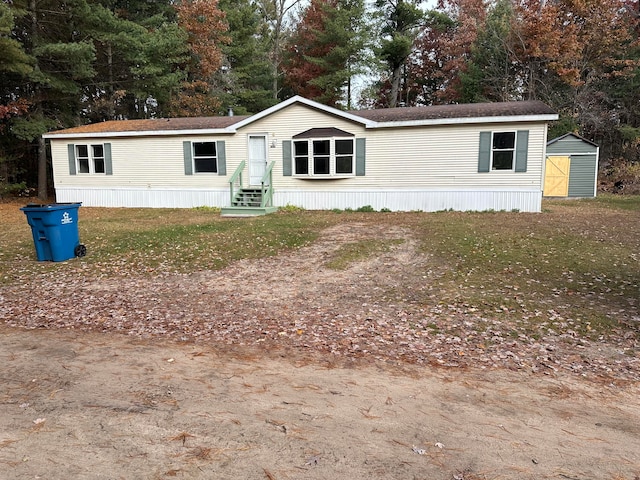 manufactured / mobile home featuring a storage unit