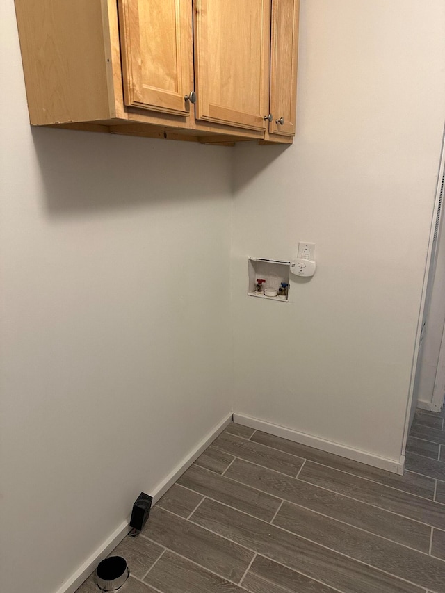 laundry area featuring hookup for a washing machine and cabinets