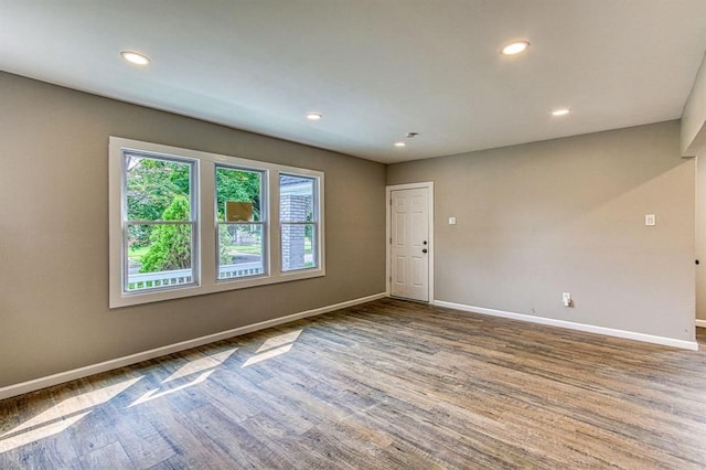 spare room with hardwood / wood-style flooring