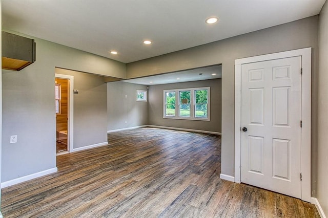 spare room with dark hardwood / wood-style flooring