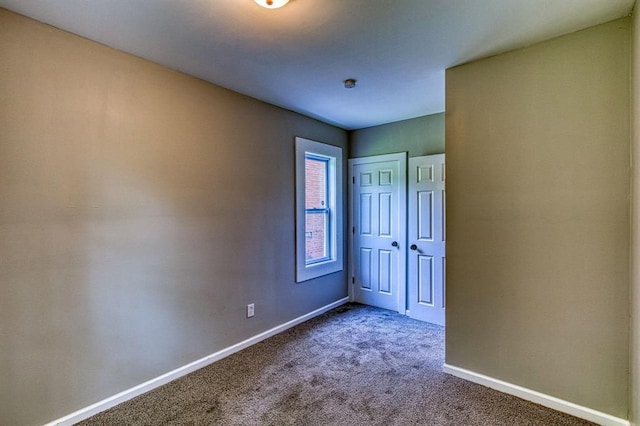 unfurnished bedroom featuring carpet