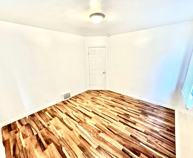 spare room featuring light hardwood / wood-style flooring