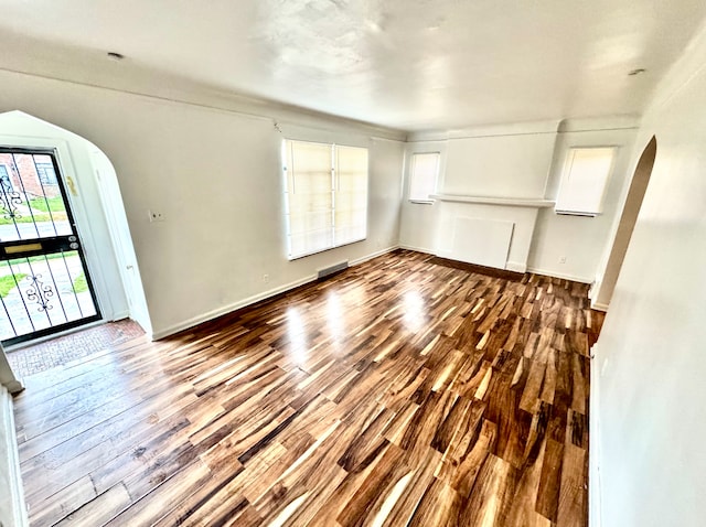 unfurnished living room with hardwood / wood-style flooring