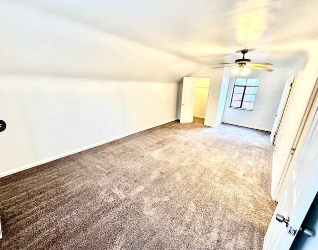 bonus room with carpet, ceiling fan, and lofted ceiling