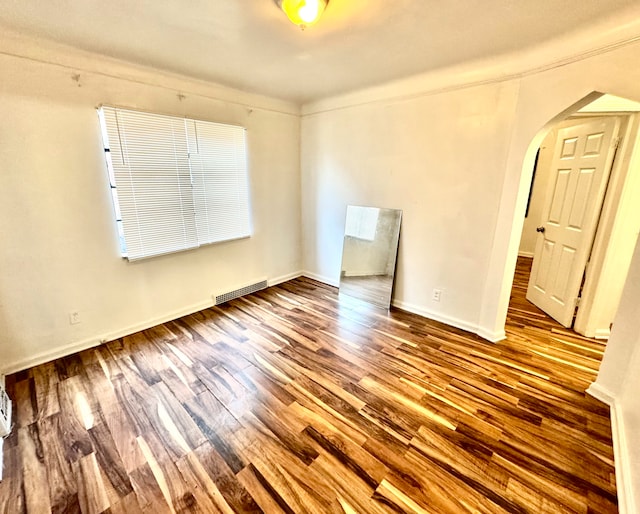 empty room featuring hardwood / wood-style flooring