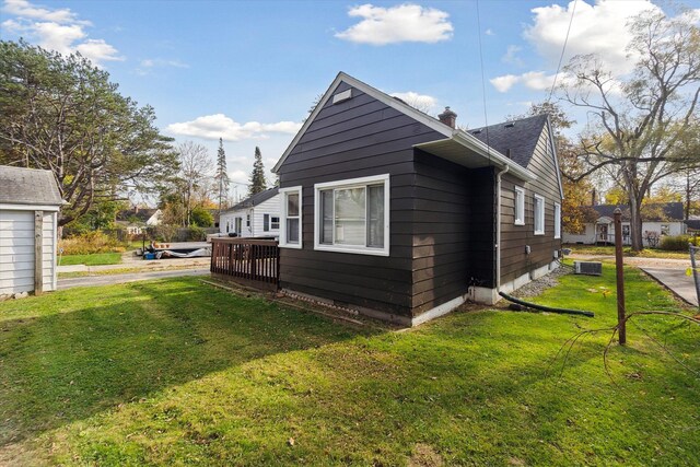 view of property exterior with a yard