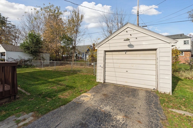 garage featuring a lawn