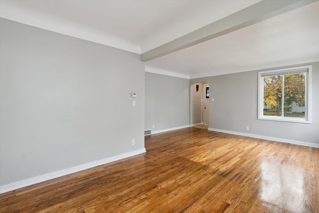 spare room featuring hardwood / wood-style flooring