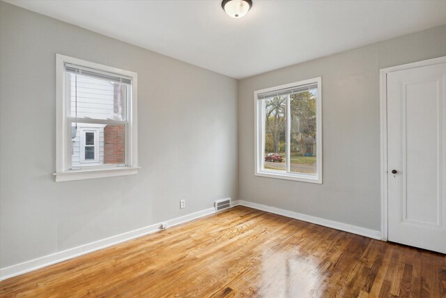 empty room featuring wood-type flooring