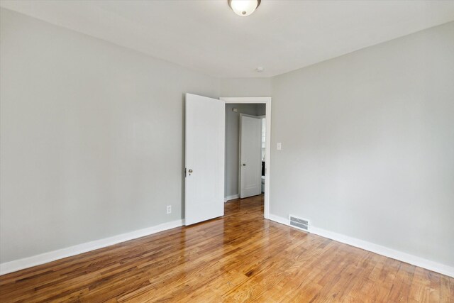 spare room with light hardwood / wood-style floors