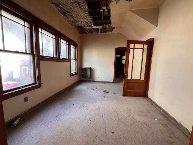 empty room featuring radiator heating unit