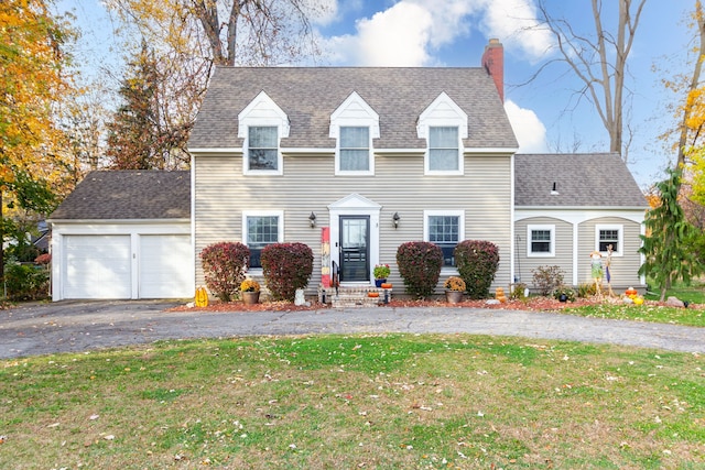 view of front facade with a garage and a front lawn