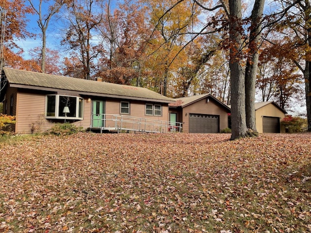 7468 W 6 1/2 Mile Rd, Irons, MI 49644 - single story home with metal roof and a chimney