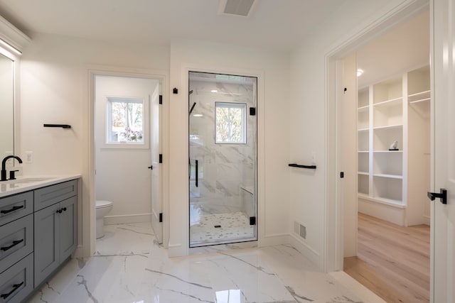 full bathroom with visible vents, a marble finish shower, baseboards, toilet, and marble finish floor