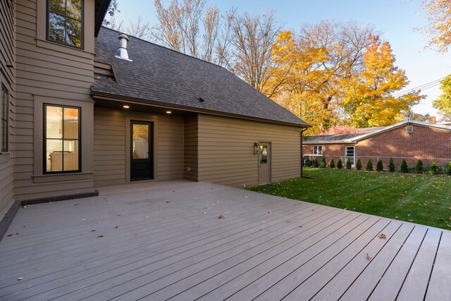 wooden terrace with a lawn