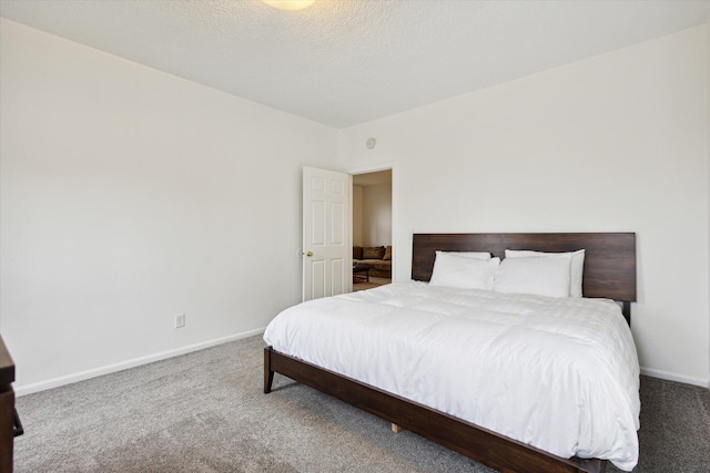 carpeted bedroom with a textured ceiling