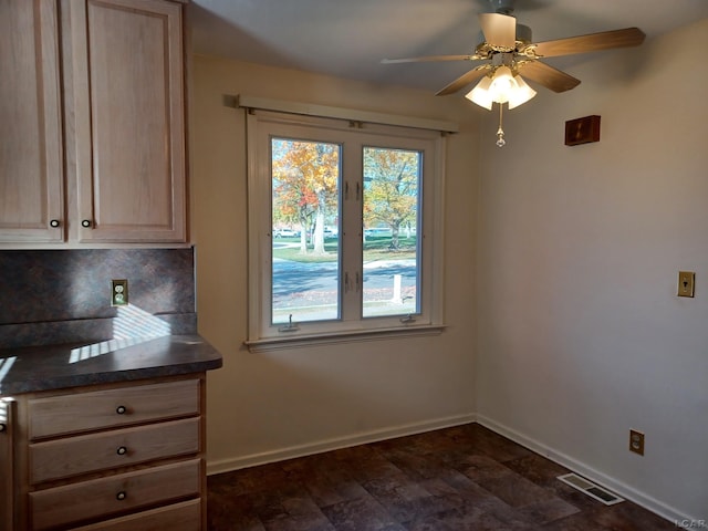 unfurnished dining area with ceiling fan