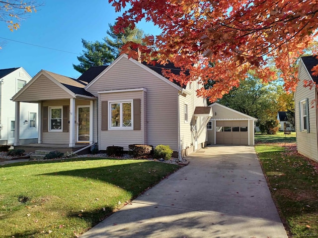 bungalow featuring an outbuilding, a front lawn, and a garage