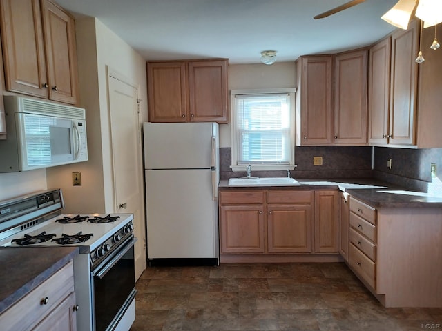 kitchen with white appliances, sink, decorative backsplash, ceiling fan, and light brown cabinetry