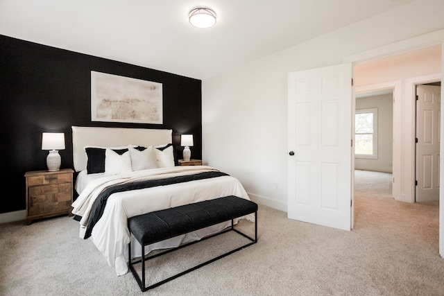 bedroom featuring light colored carpet