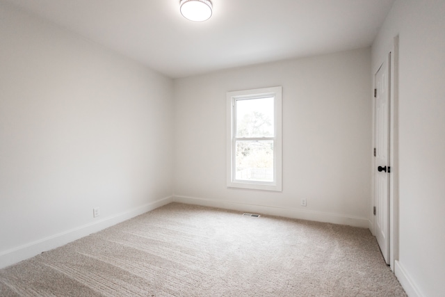 view of carpeted spare room