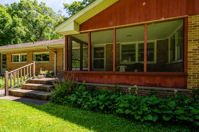 rear view of house with a sunroom