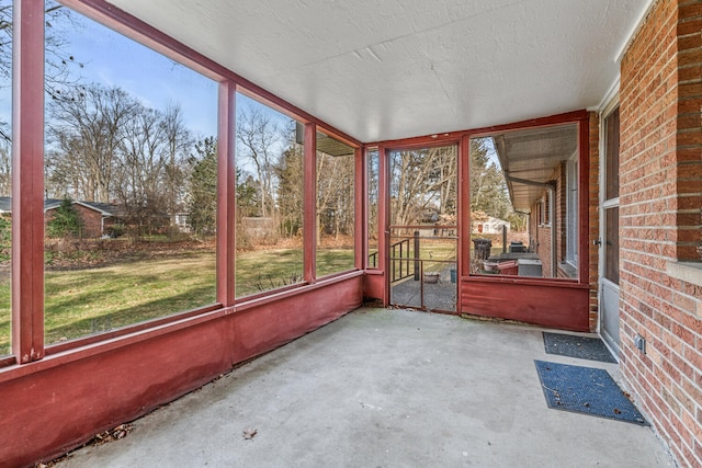 unfurnished sunroom featuring a healthy amount of sunlight