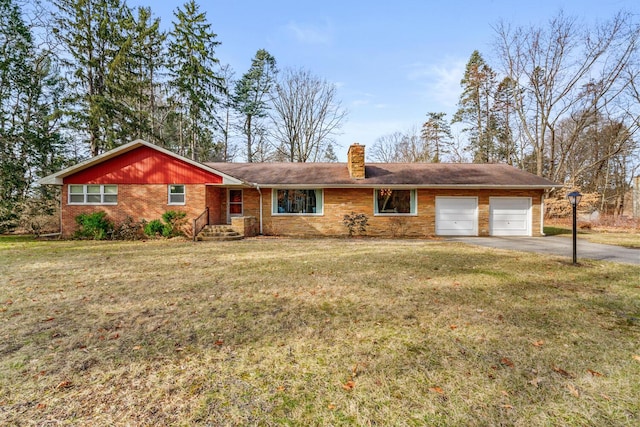 ranch-style home with a garage and a front lawn