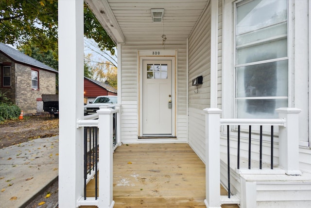 view of exterior entry with covered porch