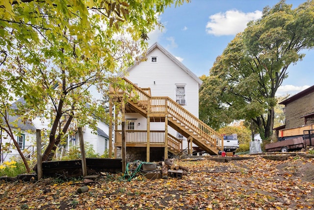 rear view of house with a wooden deck