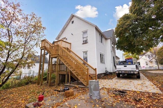 330 NE Page St, Grand Rapids, MI 49505 - back of property with stairs, a deck, and roof with shingles