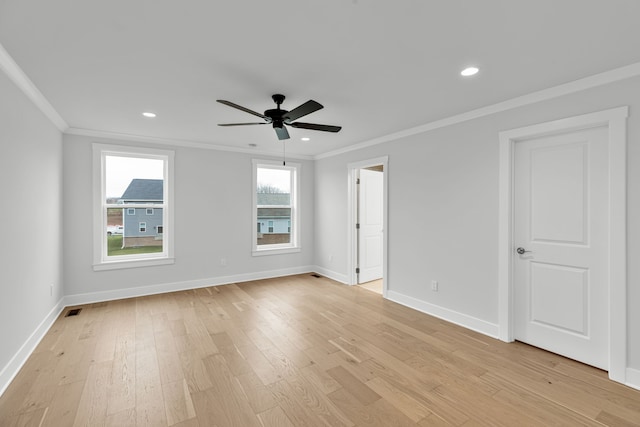 unfurnished room featuring ceiling fan, light hardwood / wood-style floors, and crown molding