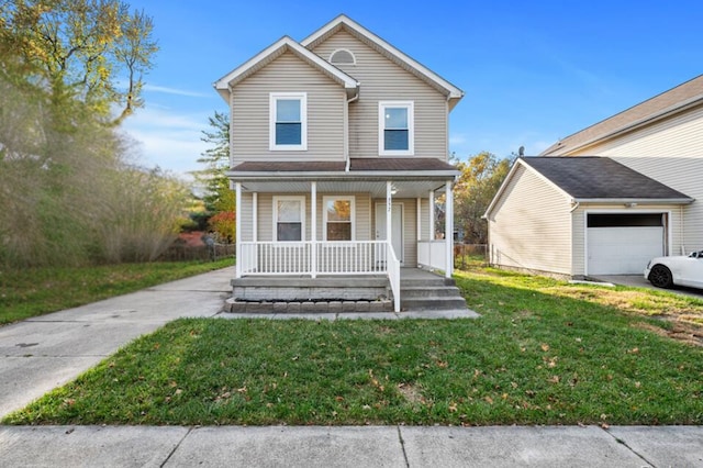 view of front property with covered porch, a front yard, and a garage